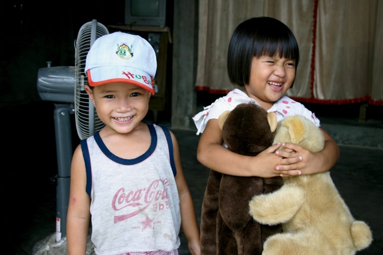 On a donor visit to Vietnam with her mom, Sandra Joyce gave some of her favorite stuffed animals to a girl whose home she and her mom helped build.